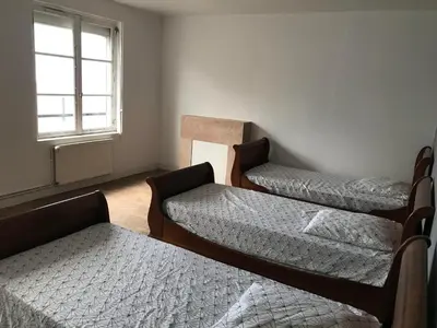 Un ou plusieurs lits dans un hébergement de l'établissement Gîte Manava - grande maison avec jardin en centre ville