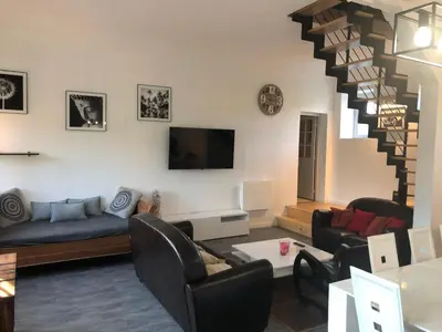 Télévision ou salle de divertissement dans l'établissement Gîte de charme à la campagne