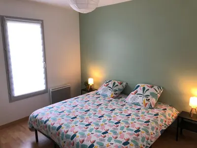 Un ou plusieurs lits dans un hébergement de l'établissement La Cancalaise - Bel appartement T4 tout confort - proche de la plage - Cancale