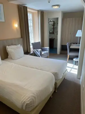 Un ou plusieurs lits dans un hébergement de l'établissement La Vieille Auberge