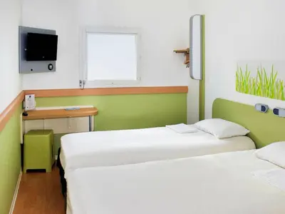 Un ou plusieurs lits dans un hébergement de l'établissement ibis budget Flers Grands Champs