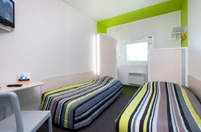 Un ou plusieurs lits dans un hébergement de l'établissement FYL GOOD ex hotelF1 Cherbourg