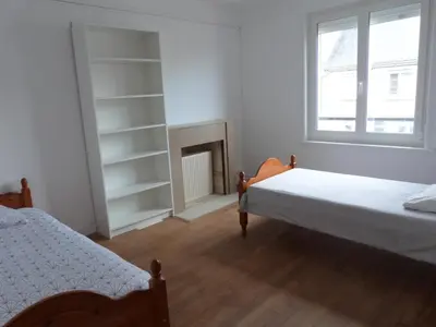 Un ou plusieurs lits dans un hébergement de l'établissement gîte iaorana - maison en centre ville