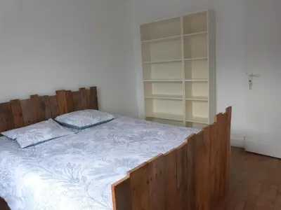 Un ou plusieurs lits dans un hébergement de l'établissement gîte iaorana - maison en centre ville