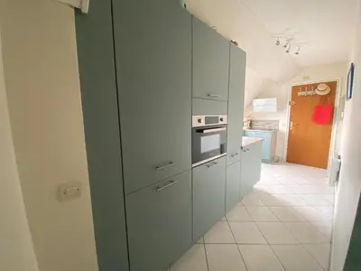 Cuisine ou kitchenette dans l'établissement Appartement Vue Mer - Cabourg - Normandie