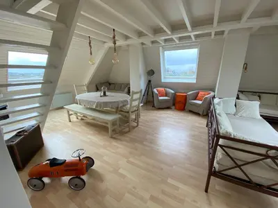 Coin salon dans l'établissement Appartement Vue Mer - Cabourg - Normandie