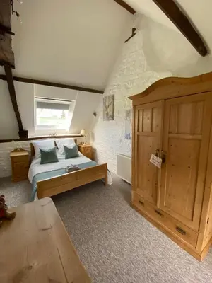 Un ou plusieurs lits dans un hébergement de l'établissement La Petite Maison - No 4 La Relierie