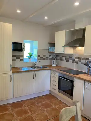 Cuisine ou kitchenette dans l'établissement La Petite Maison - No 4 La Relierie