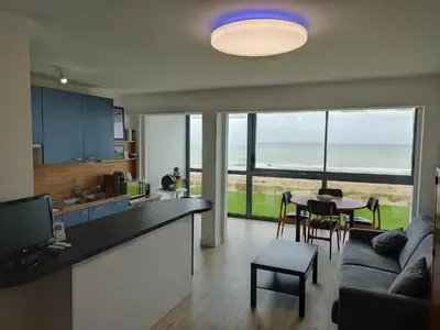 Cuisine ou kitchenette dans l'établissement 57 M2 LES PIEDS DANS l EAU Cabourg