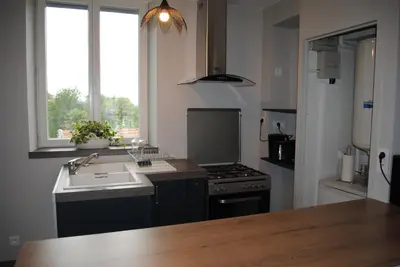 Cuisine ou kitchenette dans l'établissement Gite Le Jour J
