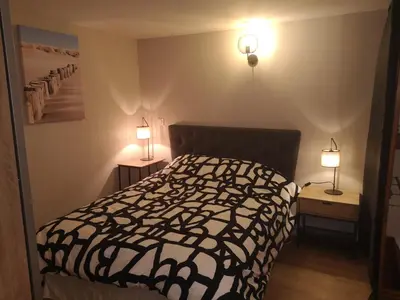 Un ou plusieurs lits dans un hébergement de l'établissement Charmante Maison studio proche mer et commerces