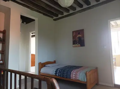 Un ou plusieurs lits dans un hébergement de l'établissement La Petellerie, maison de campagne avec piscine pour un séjour détente