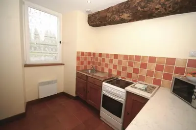 Cuisine ou kitchenette dans l'établissement La Grange