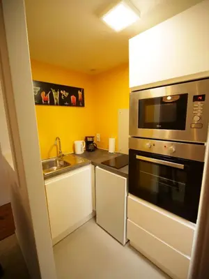 Cuisine ou kitchenette dans l'établissement Les Gîtes du Couesnon