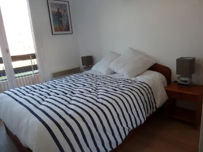 Un ou plusieurs lits dans un hébergement de l'établissement CABOURG APPARTEMENT EN RESIDENCE CALME ET COSI