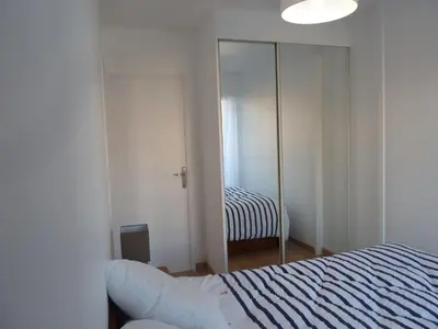 Un ou plusieurs lits dans un hébergement de l'établissement CABOURG APPARTEMENT EN RESIDENCE CALME ET COSI