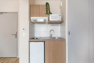 Cuisine ou kitchenette dans l'établissement Appart'City Confort Cherbourg