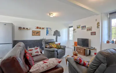 Coin salon dans l'établissement La Maison D'ici Et D'ailleurs