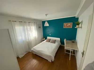 Un ou plusieurs lits dans un hébergement de l'établissement Belle Appartement lumineux avec balcon plein centre .