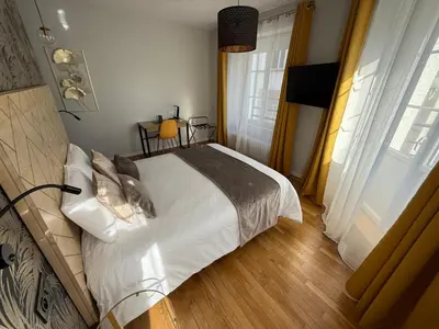 Un ou plusieurs lits dans un hébergement de l'établissement OXXOTEL & Spa