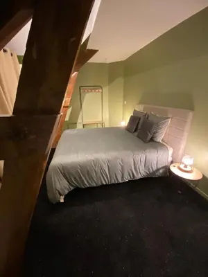 Un ou plusieurs lits dans un hébergement de l'établissement L'ATELIER DU VIEUX BOIS Spa