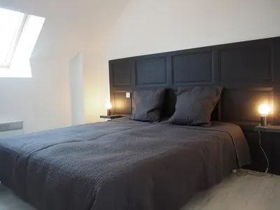 Un ou plusieurs lits dans un hébergement de l'établissement Maison Leonard