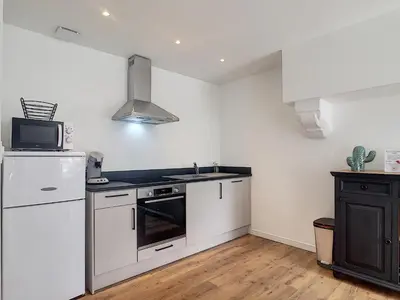Cuisine ou kitchenette dans l'établissement petite maison proche centre ville