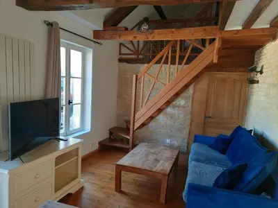 Télévision ou salle de divertissement dans l'établissement Le Delax