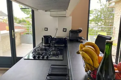 Cuisine ou kitchenette dans l'établissement Le cottage GAMA Suisse Normande