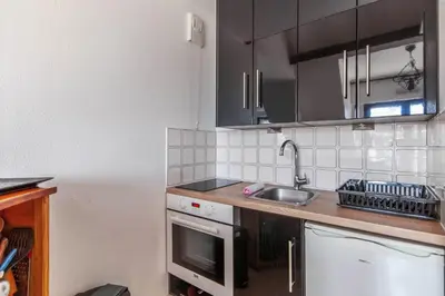 Cuisine ou kitchenette dans l'établissement Appartement Sémaphore - Welkeys