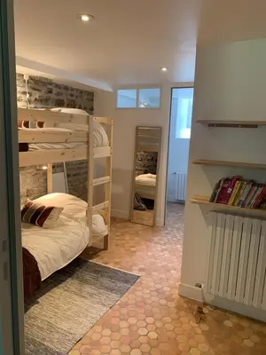 Un ou plusieurs lits dans un hébergement de l'établissement Le Logis K, le charme au cœur de Saint Pair
