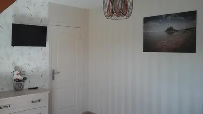 Télévision ou salle de divertissement dans l'établissement Chambres d'hôtes La Rive - Le Mont Saint Michel