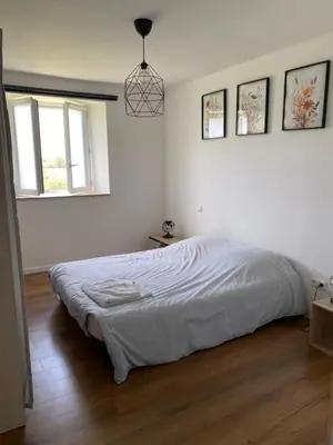 Un ou plusieurs lits dans un hébergement de l'établissement Maison en pleine nature proche plage Omaha Beach!