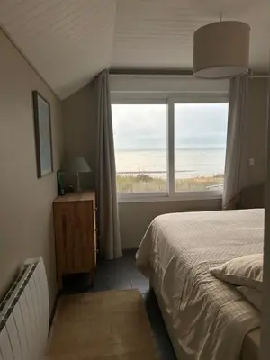 Un ou plusieurs lits dans un hébergement de l'établissement Villa Denise Petit Gîte
