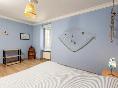 Un ou plusieurs lits dans un hébergement de l'établissement Holiday Home La Grève by Interhome