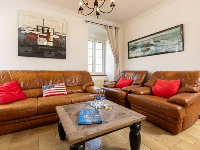 Coin salon dans l'établissement Holiday Home La Grève by Interhome