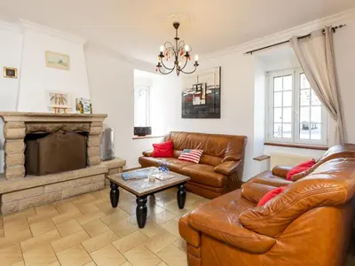 Coin salon dans l'établissement Holiday Home La Grève by Interhome