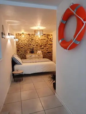 Un ou plusieurs lits dans un hébergement de l'établissement Granville plage normandie mont saint Michel