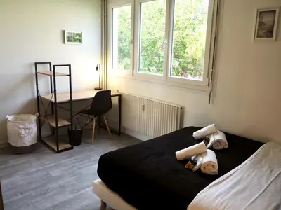 Un ou plusieurs lits dans un hébergement de l'établissement Saturne YourHostHelper