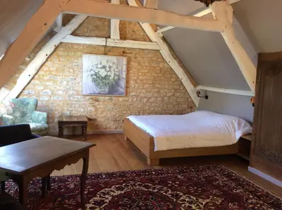 Un ou plusieurs lits dans un hébergement de l'établissement Chambres d'hôtes de charme