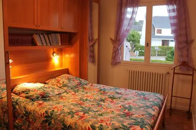 Un ou plusieurs lits dans un hébergement de l'établissement Grande maison vue sur mer