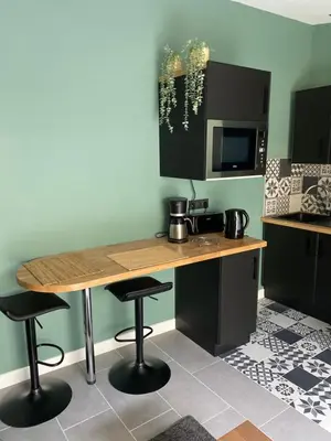 Cuisine ou kitchenette dans l'établissement Au rythme des vagues