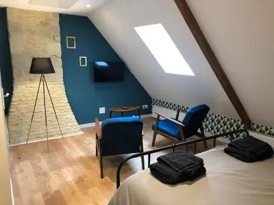 Un ou plusieurs lits dans un hébergement de l'établissement Maison de pêcheur de 1820 au cœur du bourg - 3 étoiles