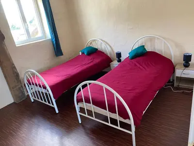 Un ou plusieurs lits dans un hébergement de l'établissement Gîte du Bois Pennier, au calme , à 15 km des plages du Débarquement