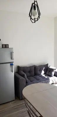 Coin salon dans l'établissement Dives Le petit Gîte