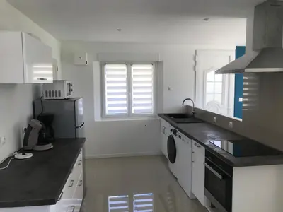 Cuisine ou kitchenette dans l'établissement Fakarava, gîte en ville au calme