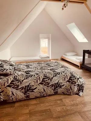 Un ou plusieurs lits dans un hébergement de l'établissement Charmante maison à deux pas de la mer