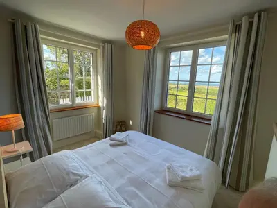 Un ou plusieurs lits dans un hébergement de l'établissement Maison de charme vue sur mer pour 6 pers