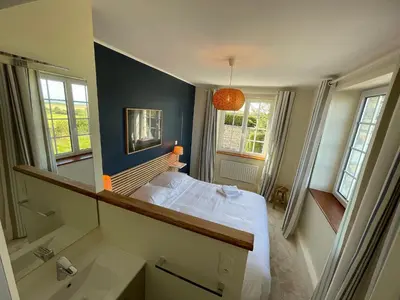 Un ou plusieurs lits dans un hébergement de l'établissement Maison de charme vue sur mer pour 6 pers