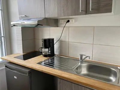 Cuisine ou kitchenette dans l'établissement La Suite Le Nôtre